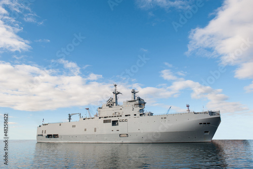 Photo: Military ship and blue sky. Military ship and blue sky.