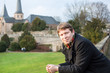 Young man enjoying spring sunshine in a German city