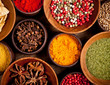 Various kind of spices in wooden bowls