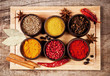 Various kind of spices in wooden bowls
