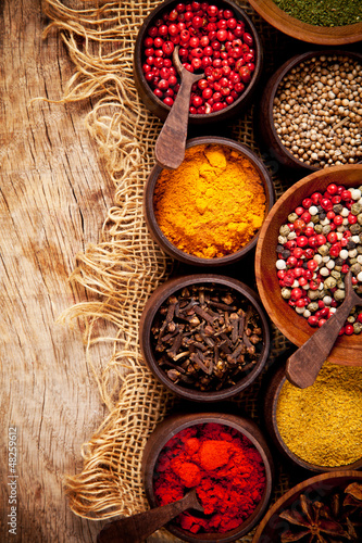 Photo: Various kind of spices in wooden bowls Various kind of spices in wooden bowls
