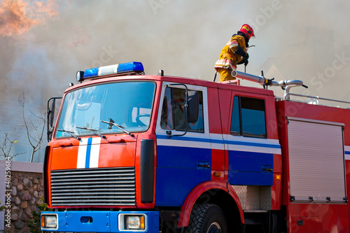 Photo: A fire-truck arrived at a burning A fire-truck arrived at a burning