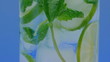 Mojito cocktail closeup on blue background