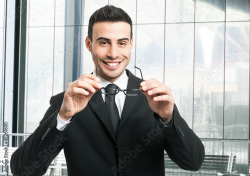 Photo: Handsome smiling businessman portrait Handsome smiling businessman portrait