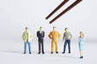Figurines with different professions standing in a row