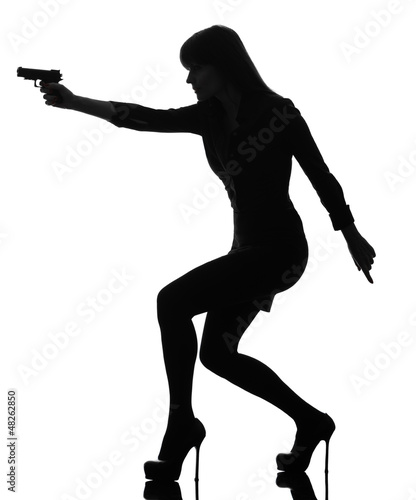 Photo: sexy detective woman holding aiming gun silhouette sexy detective woman holding aiming gun silhouette