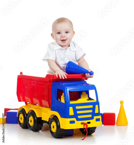 Photo: little child playing with color toys little child playing with color toys