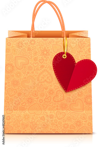 Vector: Ornate paper shopping bag with heart label on golden ribbon Ornate paper shopping bag with heart label on golden ribbon