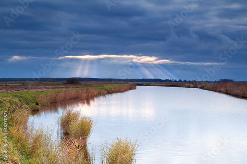Photo: sunbeams through clouded sky sunbeams through clouded sky