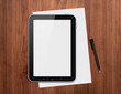 Digital tablet with pen on a desk