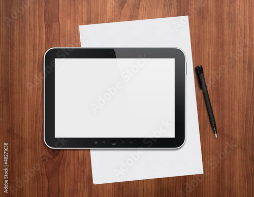 Photo: Digital tablet with pen on a desktop Digital tablet with pen on a desktop