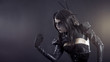 Angry witch in black latex clothes