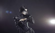 Young witch in black Victorian costume
