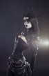 Foto: Gothic woman in black Victorian outfit Gothic woman in black Victorian outfit