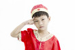 China boy in traditional Chinese red Tang suit greeting