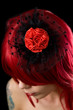 Red haired gothic girl with black hair fascinator