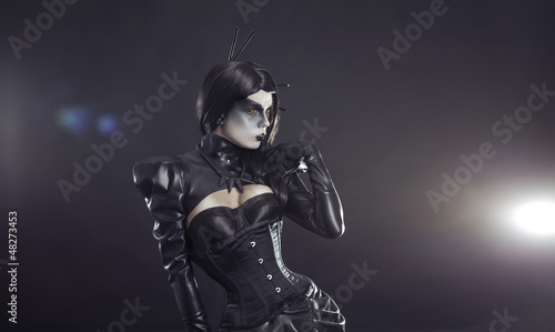 Photo: Young witch in black Victorian costume Young witch in black Victorian costume