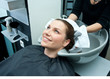 woman drying hair with towel