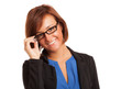 Smiling woman holding her eyeglasses