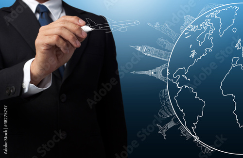 Photo: businessman drawing the concept travel around the world businessman drawing the concept travel around the world