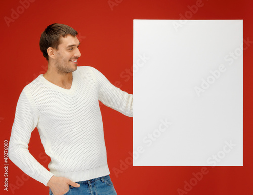 Photo: handsome man with big blank board handsome man with big blank board