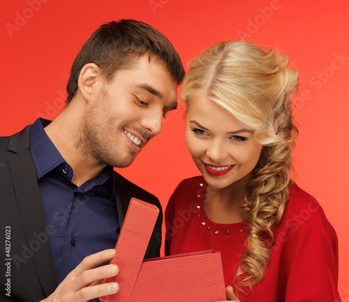 Photo: man and woman looking inside the gift box man and woman looking inside the gift box