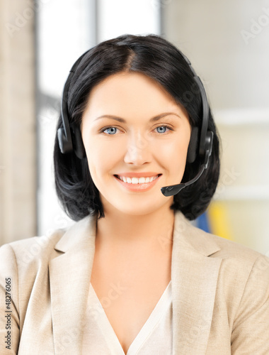 Photo: friendly female helpline operator friendly female helpline operator