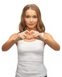 woman forming heart shape