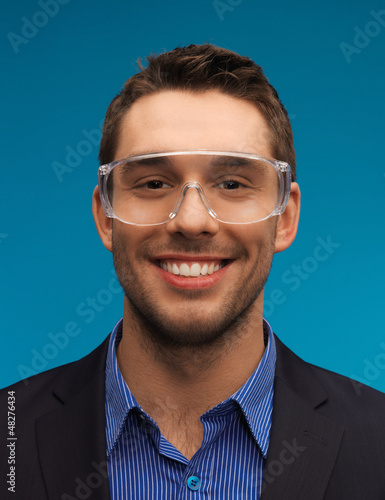 Photo: businessman in protective glasses businessman in protective glasses