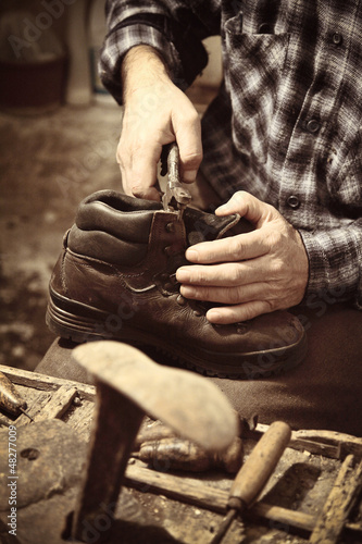 Photo: cobbler at work cobbler at work