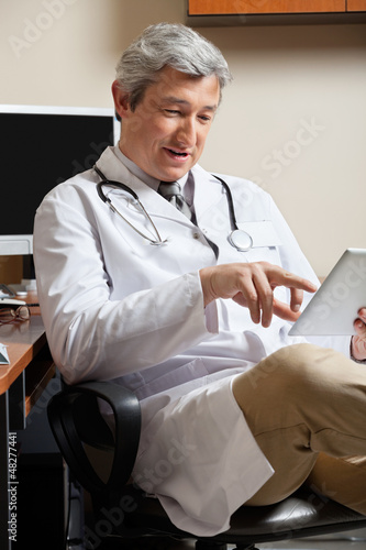 Photo: Doctor Using Digital Tablet Doctor Using Digital Tablet