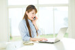 Photo: Beautiful asian businesswoman using a laptop computer Beautiful asian businesswoman using a laptop computer