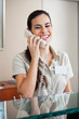 Happy Female Receptionist On Call
