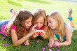 Photo: children friend girls playing internet with smartphone children friend girls playing internet with smartphone