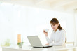 Beautiful asian businesswoman using a laptop computer
