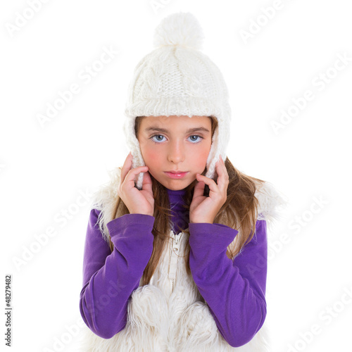 Photo: blue eyes child kid girl with white winter cap fur blue eyes child kid girl with white winter cap fur