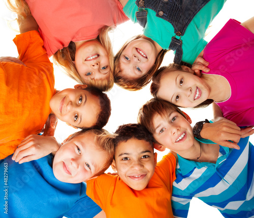 Photo: Circle of happy kids together smiling Circle of happy kids together smiling