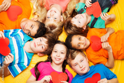 Photo: Boys and girls in circle with hearts Boys and girls in circle with hearts