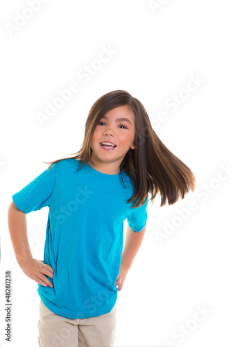 Photo: Asian child girl in blue happy smiling moving hair Asian child girl in blue happy smiling moving hair