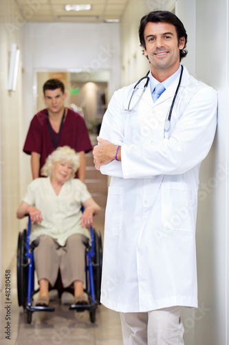 Photo: Doctor With Patient And Male Technician Doctor With Patient And Male Technician