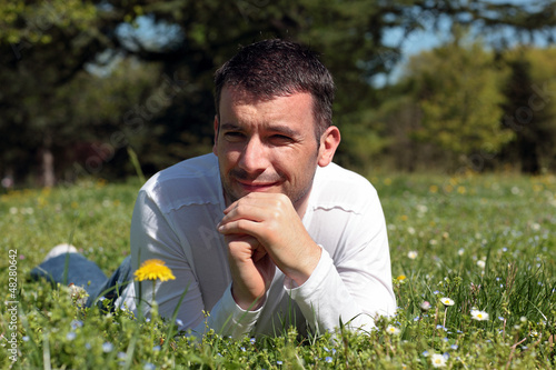 Photo: man lying on the grass man lying on the grass