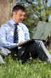 working with laptop in a park