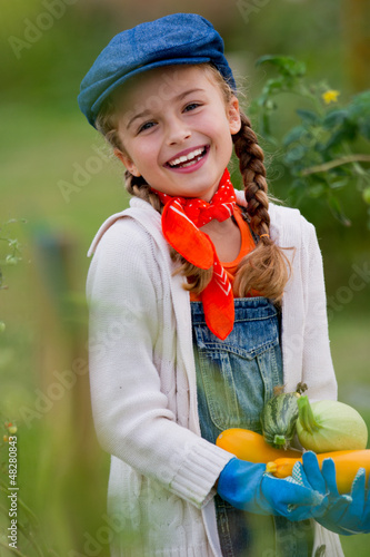 Photo: Vegetable garden - lovely girl with zuccini Vegetable garden - lovely girl with zuccini