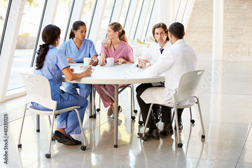Photo: Medical Staff Chatting In Modern Hospital Canteen Medical Staff Chatting In Modern Hospital Canteen