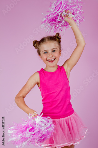 Photo: Cheerleder girl with pompoms Cheerleder girl with pompoms