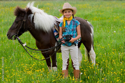 Photo: Lovely girl and little pony Lovely girl and little pony