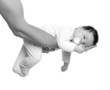almost sleeping baby girl in father arms on white