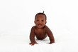 cute african american baby boy on bed