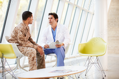 Photo: Doctor Counselling Soldier Suffering From Stress Doctor Counselling Soldier Suffering From Stress