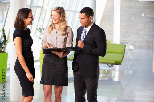 Photo: Businesspeople Having Informal Meeting In Modern Office Businesspeople Having Informal Meeting In Modern Office